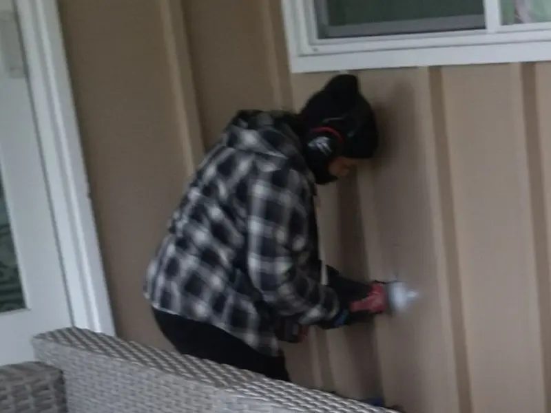 Professional electrician installing an exterior outlet in Syracuse
